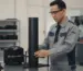 Impact Tester NOVOTEST STRIKE-U30630 - Alat uji dampak presisi untuk deteksi cacat coating, dengan tampilan digital dan mekanisme pukulan.